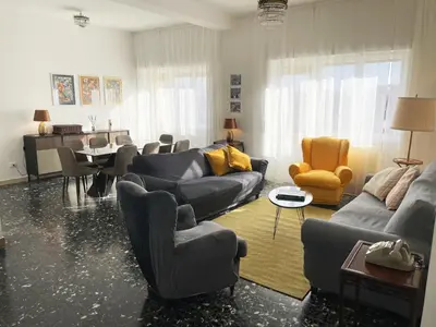 a living room with couches and a dining room at Oasi urbana - The Vatican Roof Garden in Rome