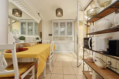 a kitchen with a dining table and a microwave at Luxury Navona apartments by Flatinrome in Rome