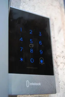 a close up of a clock with blue numbers on it at Alloggio Appio Claudio con Corte Esclusiva I Metro A in Rome