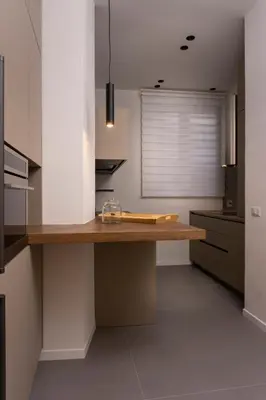 a kitchen with a counter with a cutting board on it at Exclusive apartments piazza di spagna 32 in Rome