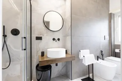 a bathroom with a sink and a mirror at Una Terrazza su San Pietro in Rome