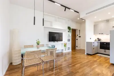 a kitchen and dining room with a table and chairs at Una Terrazza su San Pietro in Rome