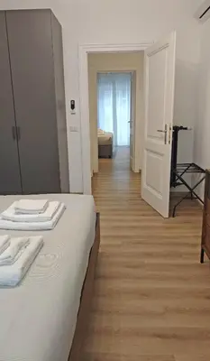 a bedroom with a bed with two towels on it at RomeBestHome Scialoja - Piazza del Popolo in Rome