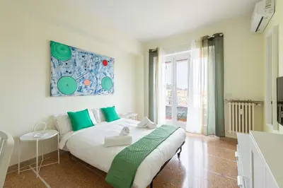 a bedroom with a bed and a large window at 7h Heaven RHome Vatican Museums in Rome