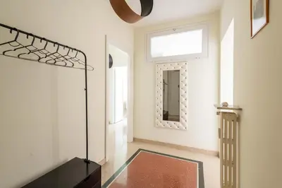 a living room with a mirror and a table at 7h Heaven RHome Vatican Museums in Rome