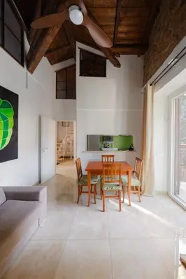 a dining room with a wooden table and chairs at Villa Agostina in Rome