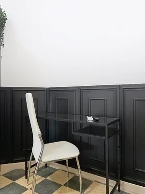 a desk with a chair and a glass table at Villa Carpegna House 10 Minuti from Vatican San Peter in Rome