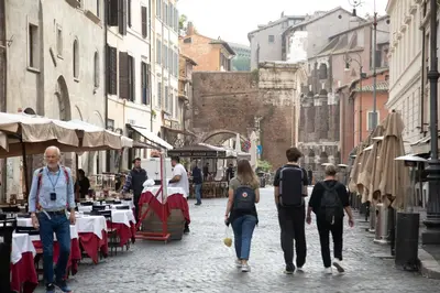 a group of people walking down a street at Roxy luxury house Rome in Rome