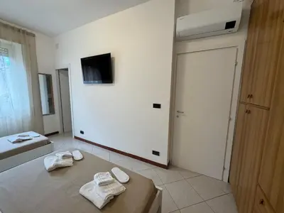 a room with two towels sitting on a table at Vacanze Romane Apartment in Rome in Rome