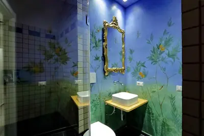 a bedroom with a bed and a vase with flowers at Vatican Family Romantic Suite in Rome