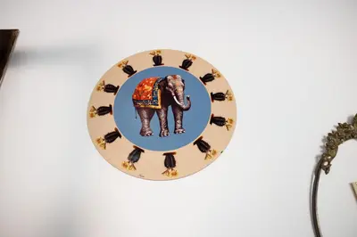 a plate with an elephant on a wall at Perduta a Rome in Rome