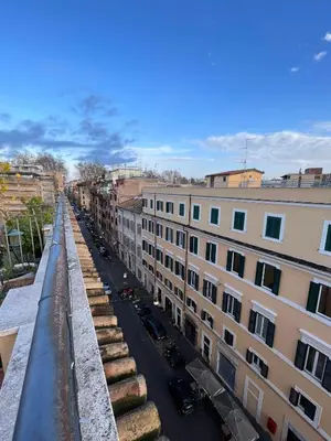 a view of a city street with buildings at A Terrace With a View in Rome