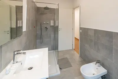 a bathroom with a sink and a shower at Piazza Lodi - Apartment in Rome