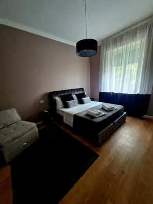 a bedroom with a bed and a couch at Vatican Charme&Chic in Rome