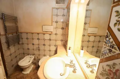 a bathroom with a sink and a toilet at Domus Antica Navona in Rome