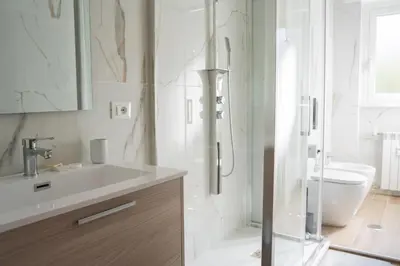 a bathroom with a shower and a sink and a toilet at Garbatella Bridge Apartment in Rome