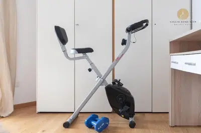 an exercise bike on the floor in a kitchen at Giglio Dome View - St Peter View, 300mt to Metro A, Vatican City, A-C in Rome