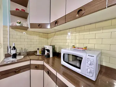 a kitchen with a white microwave on a counter at A Casa di Gio in Rome