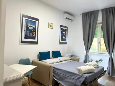 a hospital room with two beds and a table at Viale4Venti in Rome