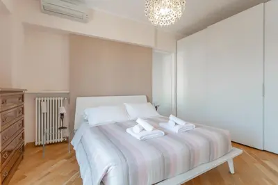 a bedroom with a bed with two towels on it at Monteverde 2BDR Penthouse in Rome