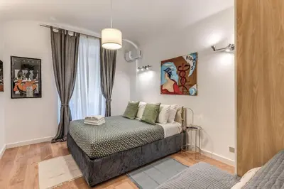 a bedroom with a bed and a window at Fresh House San Lorenzo in Rome