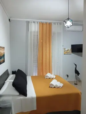 a bedroom with a bed with towels on it at Giosephine House in Rome