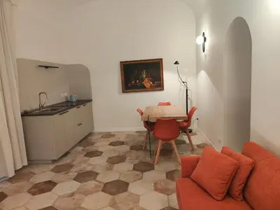 a living room with a couch and a table at Rare Seed Trastevere in Rome