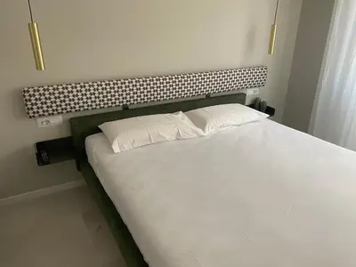a bed with two pillows on it in a bedroom at Casa vacanze Belsito in Rome