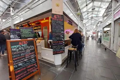a food court with many signs in a building at YCH-Luminoso appartamento nel cuore di Testaccio in Rome