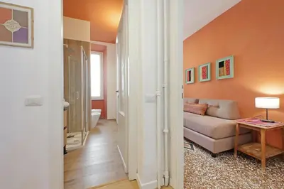 a living room with a couch and a table at YCH-Riboty House al Vaticano in Rome
