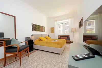 a bedroom with a bed and a desk at YCH-Riboty House al Vaticano in Rome