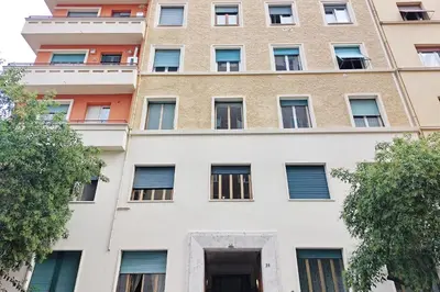 an apartment building with windows at YCH-Riboty House al Vaticano in Rome