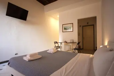 a bedroom with a bed with two towels on it at Lovely studio in Campo de Fiori in Rome