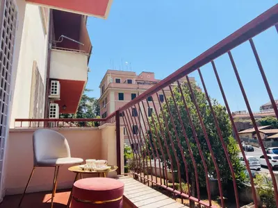 a balcony with a table and chairs and a view at San Pietro Luxury Relais in Rome