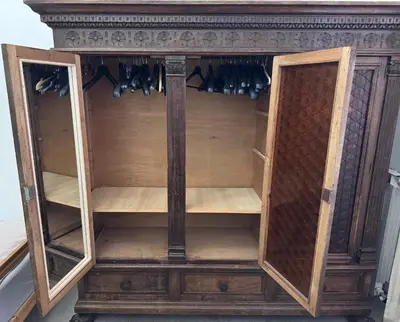 an antique wooden cabinet with glass doors and a wooden shelf at Martino rooms Termini in Rome