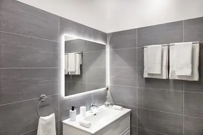 a bathroom with a sink and a mirror at Appartamento Roma Prefetti Suite in Rome