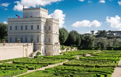 a large building with a garden in front of it at Casetta Cerquetti, a Monteverde in Rome
