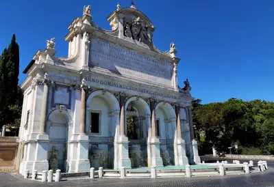 a building with a statue on top of it at Triple room a few steps from Tiber in Rome