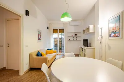 a living room with a white table and a couch at Appartamento con terrazza vicino S Pietro in Rome
