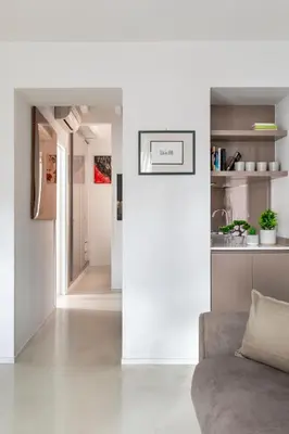 a living room with a couch and a kitchen at Vittoria apartment BDB in Rome