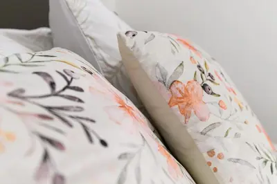 a close up of two pillows on a bed at La Scaletta Furio Camillo in Rome
