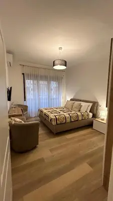a bedroom with a bed and a living room at Vatican suite Rhome in Rome