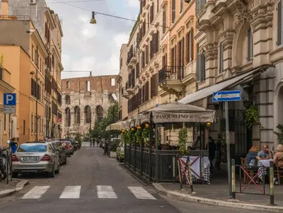 a city street with cars parked on the street at Colosseo 85 in Rome