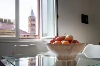 a bowl of fruit on a glass table with a window at Peace Window Roma in Rome