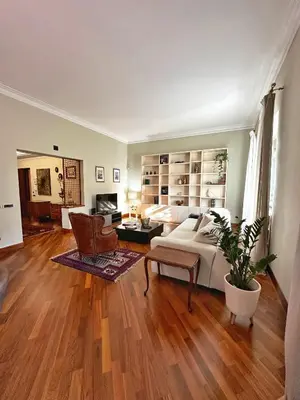 a bedroom with a bed and a living room at Casa di Gianni in Rome
