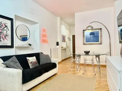 a living room with a couch and a table at Exclusive Apartment in the Heart of Rome in Rome