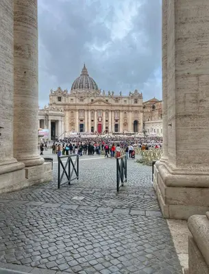 a large building with a crowd of people in front of it at Domus Dolce Vita - Apartment in Rome