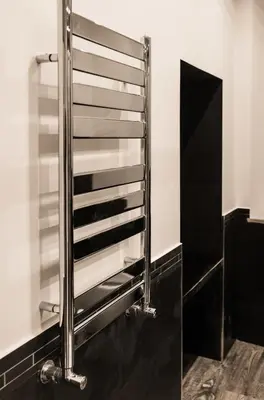 a metal towel rack in a bathroom at Trevi & Pantheon Luxury Rooms in Rome