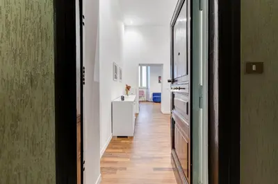 a hallway with a white refrigerator in a room at InTheMoodForRome - Musei Vaticani in Rome