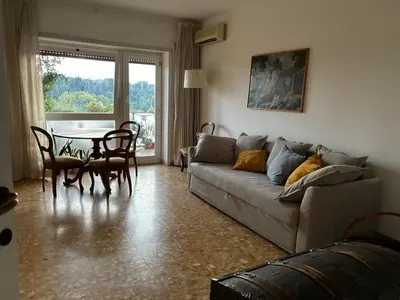 a living room with a couch and a table at Conca d'Oro 212 in Rome